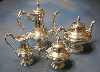 A 4 piece silver plated tea/coffee service comprising teapot, coffee pot, lidded sucrier and cream jug
