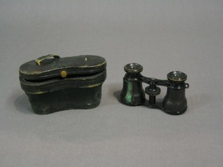 A pair of opera glasses cased