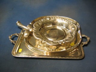 2 circular embossed silver plated dishes, a silver plated apple shaped tray and 2 rectangular silver plated twin handled trays (5)