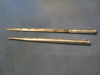 A Persian Ottoman period silver dagger with 12" single edged blade, contained in an embossed silver scabbard, with Tughra marks