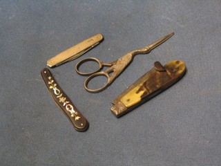A pen knife with silver mounts, a 19th Century scalpel  in a horn and mother of pearl grip by Mappin, a folding steel and horn boot hook and a pair of scissors in the form of a stork