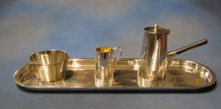 An Art Deco 4 piece silver plated coffee service comprising oval tray, side handled coffee pot, cream jug and sugar bowl by Asprey's