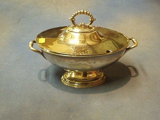 An oval silver plated twin handled soup tureen and cover on oval base 11"