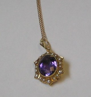 An Edwardian amethyst pendant set in an 18ct gold mount surrounded by pearls, hung on a 9ct gold chain
