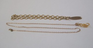 A gold identity bracelet, a gold charm in the form of a scorpion and a fine gold chain