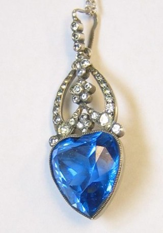 A blue heart shaped stone set in a silver marcasite mount hung on a silver chain