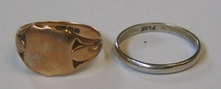 A platinum wedding band and a 9ct gold signet ring