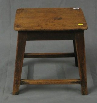 A 19th Century rectangular elm stool on square supports 16"