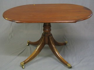 A handsome Regency mahogany gun barrel turned and tripod breakfast table base ending in brass caps and castors (f and r), together with a later associated oval top 48"