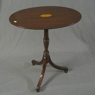 A 19th Century oval inlaid mahogany wine table, raised on ring turned pillar and tripod supports 24"