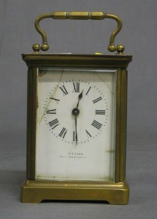 A French 19th Century carriage clock with enamelled dial and Roman numerals, marked T W Lamb