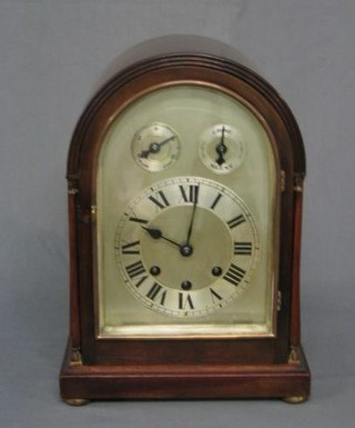 An Edwardian chiming bracket clock with arch shaped silvered dial, slow/fast indicator, silent/chime indicator, contained in a mahogany arched case, raised on bun feet