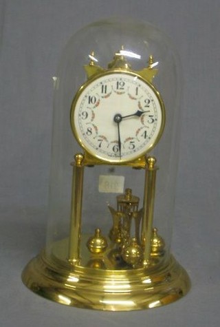 A German 400 day clock with porcelain dial and Arabic numerals complete with glass dome