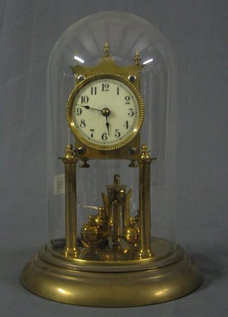 A 400 day clock with enamelled dial and Arabic numerals contained in a gilt metal case complete with dome