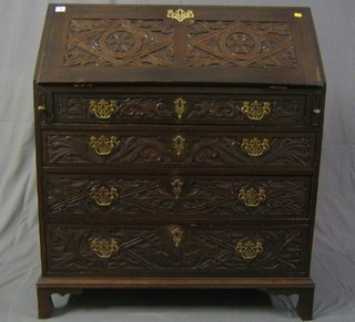 A 19th Century carved oak bureau with fall front revealing a well fitted interior, above 4 long drawers with brass swan neck drop handles, raised on bracket feet 36"