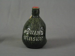 A pottery flagon of Dewar's whiskey