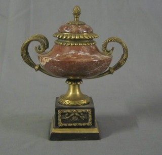 A fine quality 20th Century polished pink polished hard stone urn with gilt metal mounts 11"