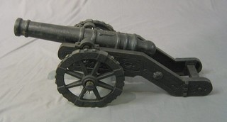 A 20th Century folly cannon with 20" barrel and raised on an iron trunion