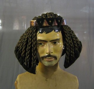 A manequin gentleman's head and an Egyptian head dress