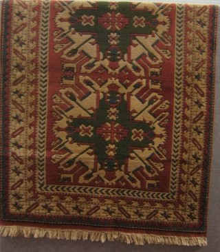 A contemporary cream ground Turkey carpet 77" x 54"