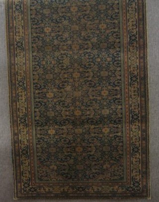 A machine made Persian style rug with all over geometric design 71"  x 35" (some wear)