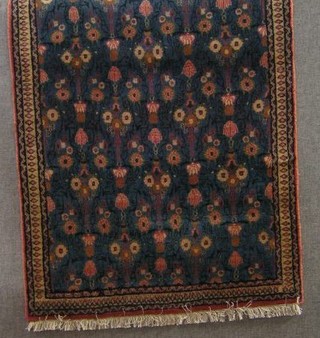 A contemporary Persian Veramin rug, blue ground and floral patterned 57" x 36"