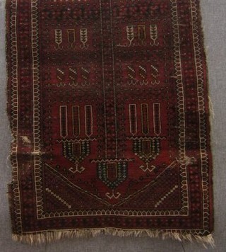 An Afghan prayer rug 54" x 34" (in wear)