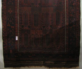 A 19th Century Afghan rug with geometric design within multi-row borders (some wear) 136" x 86"