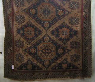 A 19th Century Sumac rug with 3 octagons and diamonds to the centre and geometric designs to the borders 120" x 81"