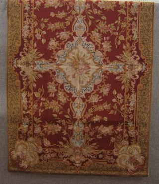 A contemporary Aubusson needlepoint wall hanging with floral decoration against a brown ground 72" x 42"