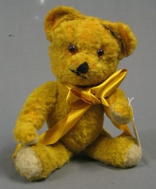 A yellow teddybear with articulated limbs 12"