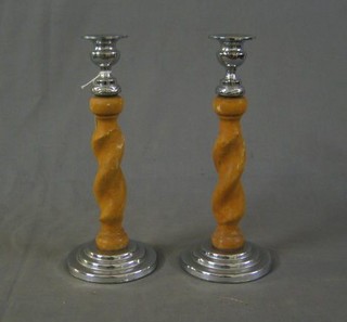 A pair of bleached oak spiral turned candlesticks with chromium plated mounts 10"