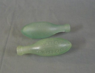 2 torpedo shaped glass bottles marked G Mumby & Co