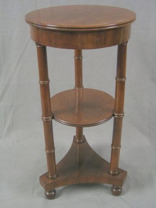 A French 19th Century circular 3 tier occasional table on column supports with triform base 16"