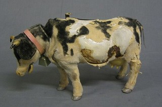 A 1950's Japanese tin plate battery operated model of a walking Fresian cow 13"