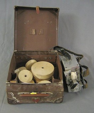 A Strength Register bus tick machine no. M1077D complete with case and various reels of tickets