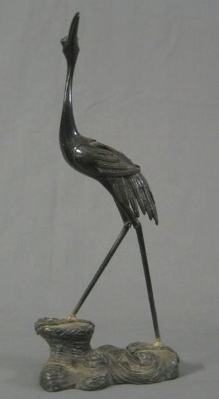 A bronze figure of a standing crane 18" (f and r)