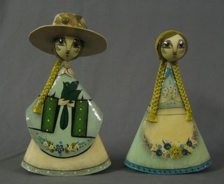 A pair of Mexican papier mache figures of lady's 15"