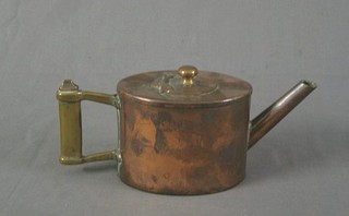 A 19th Century oval copper tea pot with brass handle 5"
