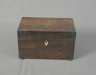 A 19th Century rectangular rosewood twin compartment tea caddy raised on bun feet 8"