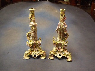 A pair of 19th Century Continental porcelain candlestick bases in the form of a lady and gentleman 15" (f)