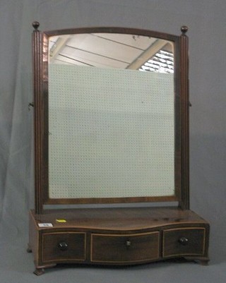 A 19th Century arch shaped plate dressing table mirror contained in a mahogany frame and raised on a serpentine inlaid base fitted 1 long and 2 short drawers, raised on bracket feet 18"