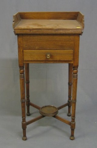 A  Georgian mahogany bedside cabinet with three-quarter gallery, fitted a drawer raised on ring turned supports with X framed stretcher 19"