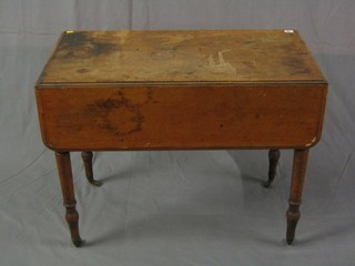 A Victorian mahogany Pembroke table fitted a drawer, raised on ring turned supports ending in brass caps and castors, 36"