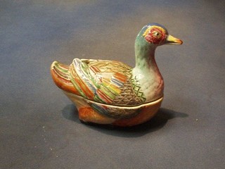 An Oriental porcelain egg store in the form of a seated duck decorated polychrome enamels 8"