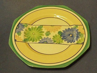 3 Clarice Cliff octagonal shaped plates with green, black and yellow banding and floral stripe to the centre, 9" (1 chipped and cracked)