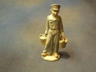 A Lladro figure of a boy with 2 buckets of water, base marked Lladro and incised D, 9"