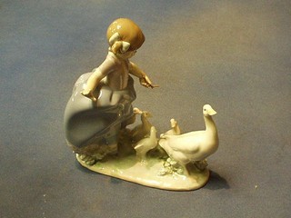A Lladro figure of a girl with geese, the base incised F3MY 5503 8"