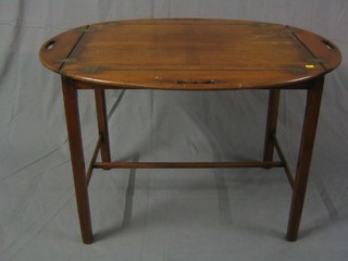 A reproduction Georgian mahogany folding butler's tray on stand 30"