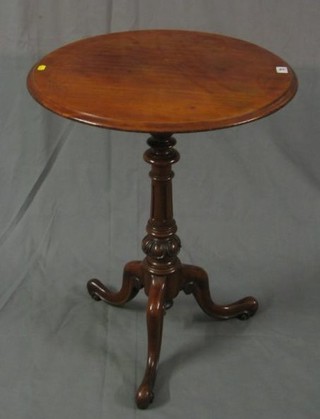 A Victorian circular walnut wine table, raised on turned and fluted column with tripod base 22"
